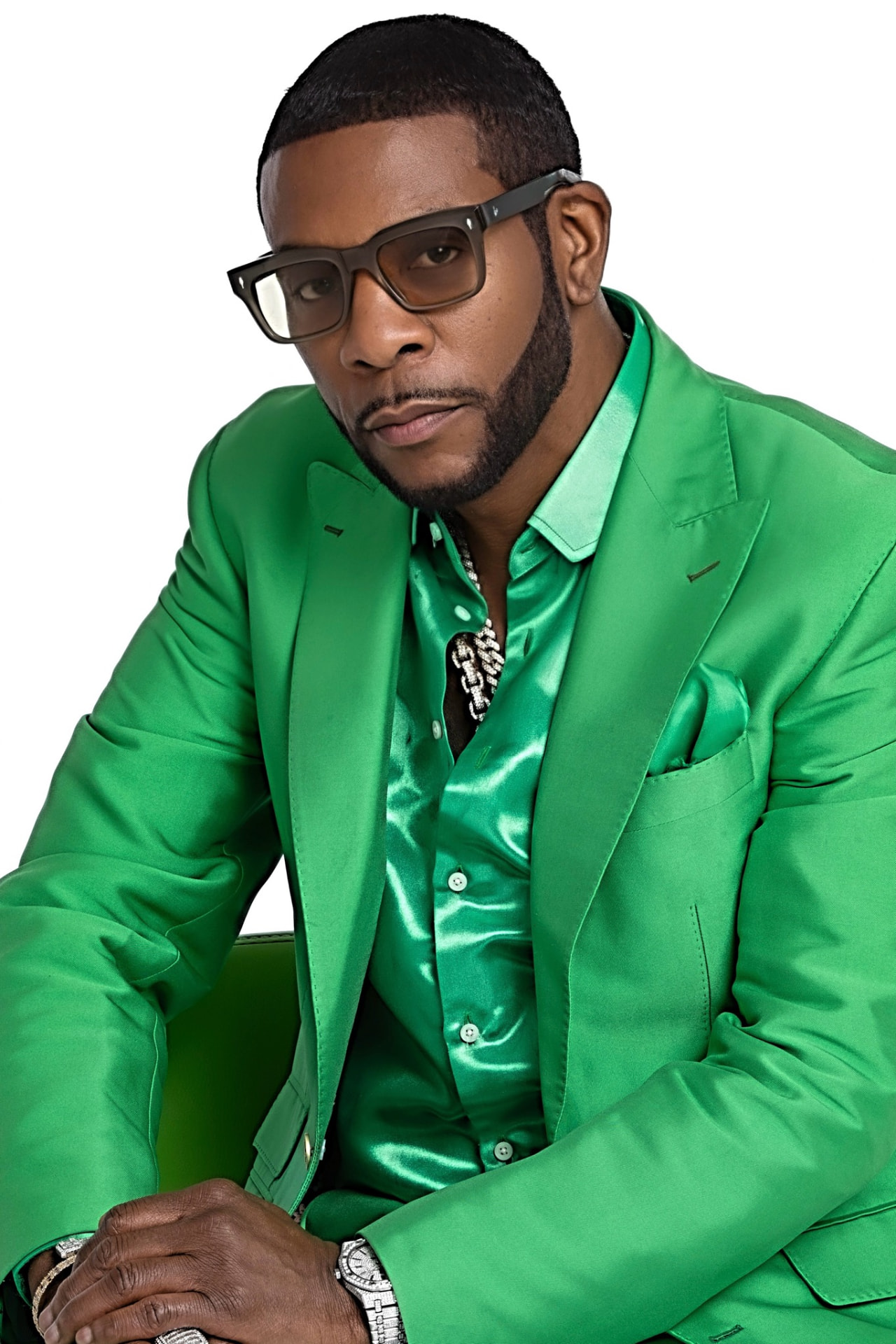 Portrait of Keith Sweat in an emerald suit